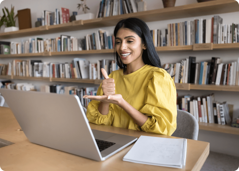Woman smiling during a video call.